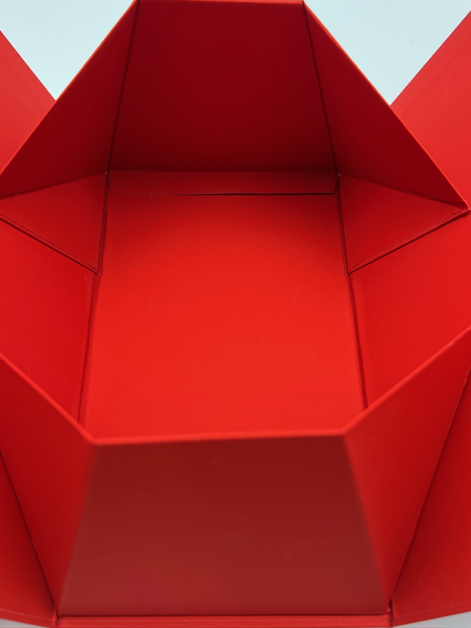 Folding triangular handheld box